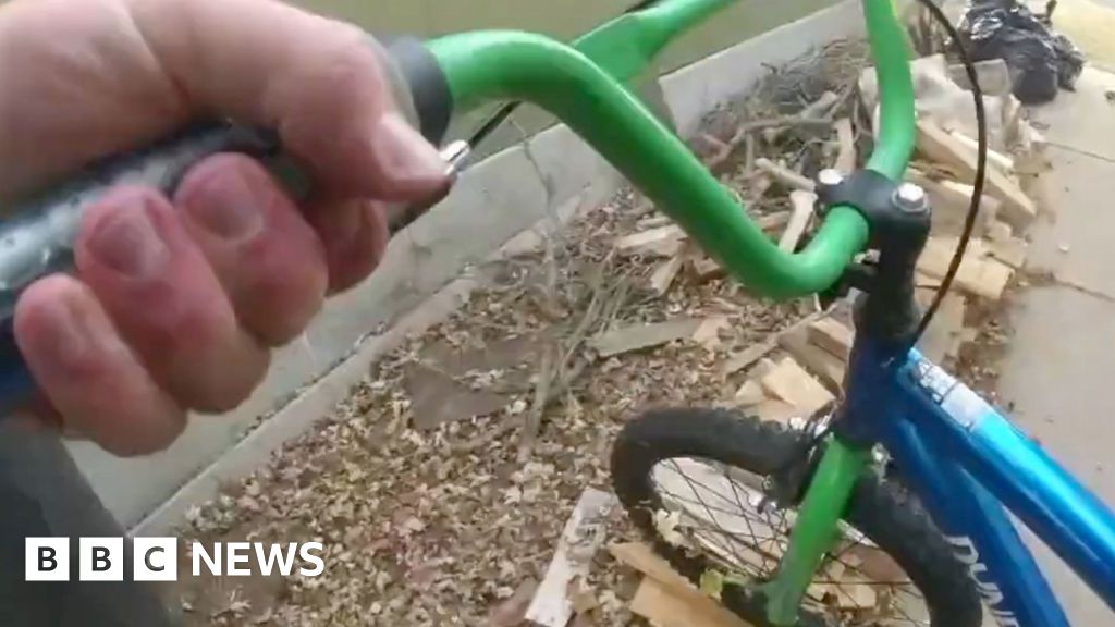 Police officer uses child's bike to chase suspect on scooter