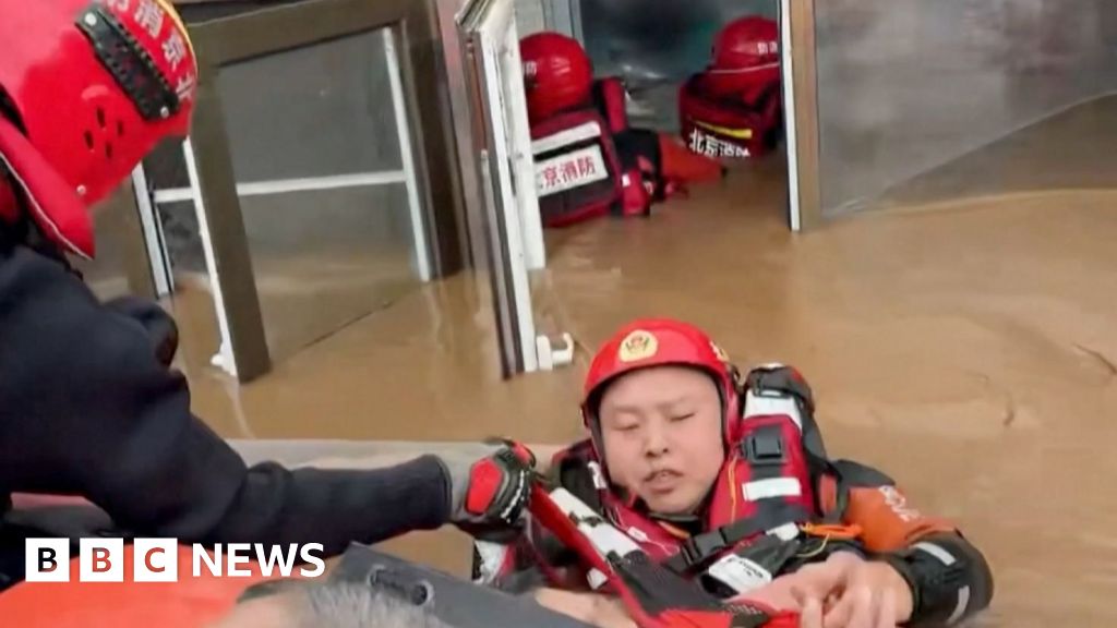 People rescued from a nursing home and flooded streets in China