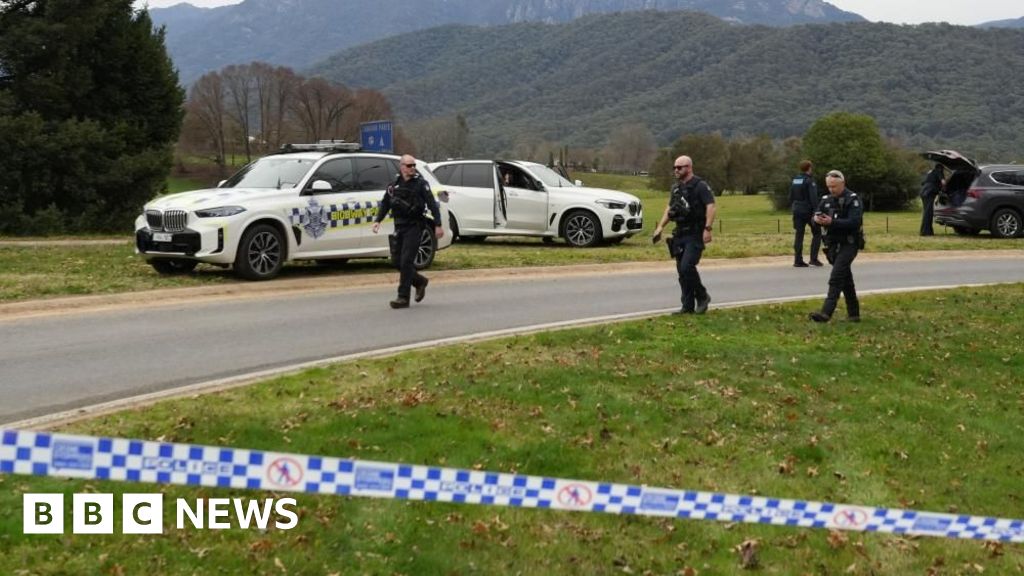Manhunt after two police officers shot dead