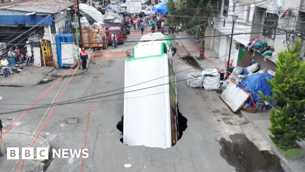 Soda truck falls into sinkhole in Mexico City
