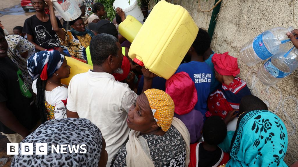 Macron visits Mayotte as thousand still missing after storm