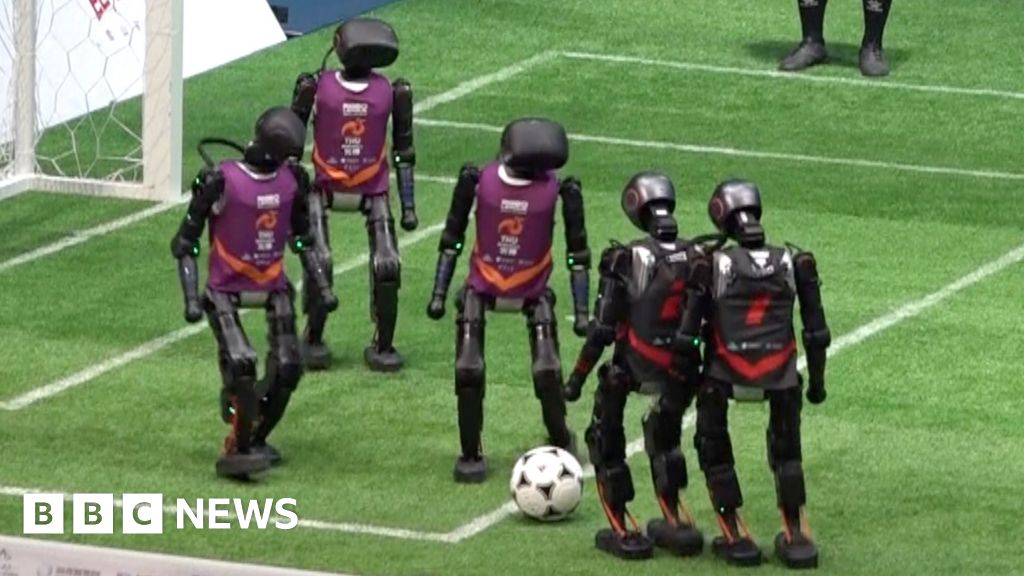 Humanoid robots stumble through football match in China